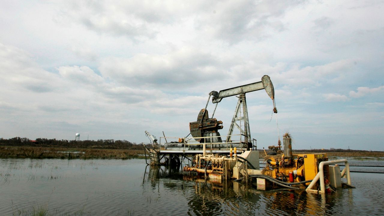 A pump jack is seen surrounded by flood waters left behind by Hurricane Ike on the High Island Oil Field. (AP Photo/Tony Gutierrez)