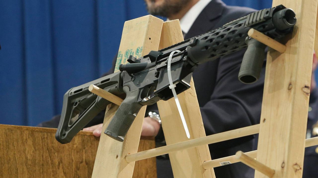 A homemade fully automatic rifle is displayed at a news conference on Jan. 13, 2014. (AP Photo/Rich Pedroncelli)