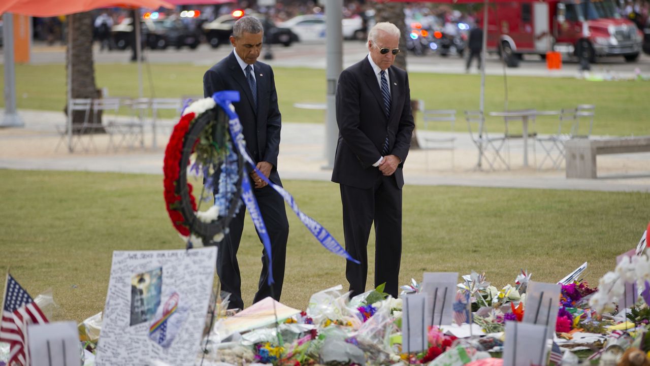 FILE PHOTO: President Barack Obama and Vice President Joe Biden visit a memorial to the victims of the Pulse nightclub shooting, Thursday, June 16, 2016 in Orlando, Fla. (AP Photo/Pablo Martinez Monsivais)
