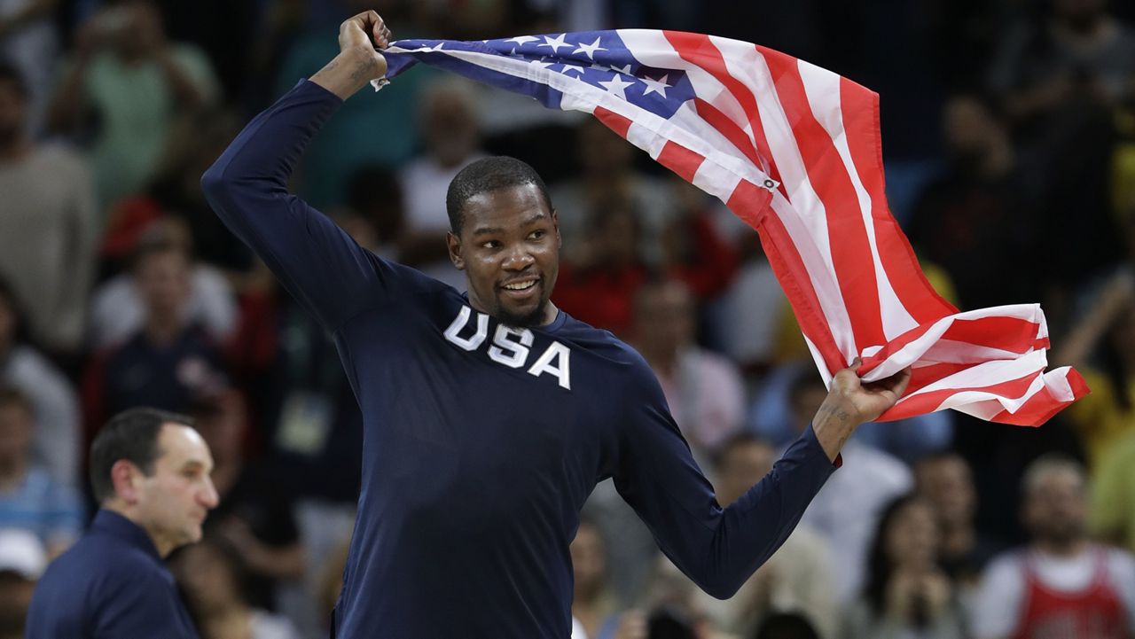 United States' Kevin Durant (5) celebrates winning the men's basketball gold medal at the 2016 Summer Olympics in Rio de Janeiro, Brazil, Sunday, Aug. 21, 2016. (AP Photo/Eric Gay)