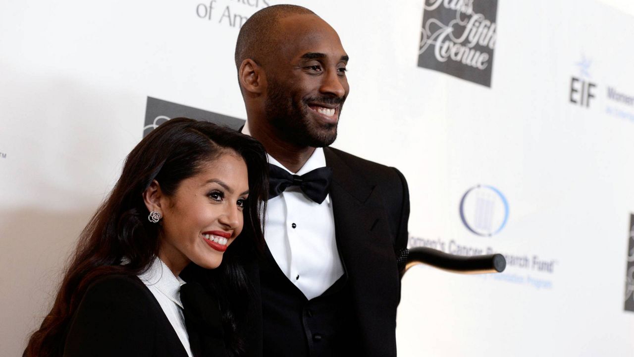 In this May 2, 2013, file photo, Kobe Bryant, right, and his wife Vanessa Bryant arrive at 