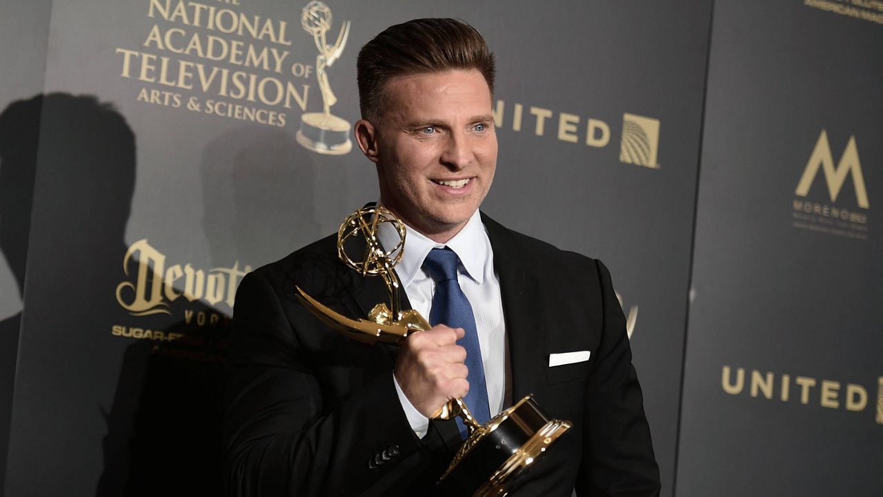 Steve Burton holds up his Daytime Emmy for outstanding supporting actor in a drama series, for his role in "The Young and the Restless," on April 30, 2017, in Pasadena, Calif. (Photo by Richard Shotwell/Invision/AP, File)