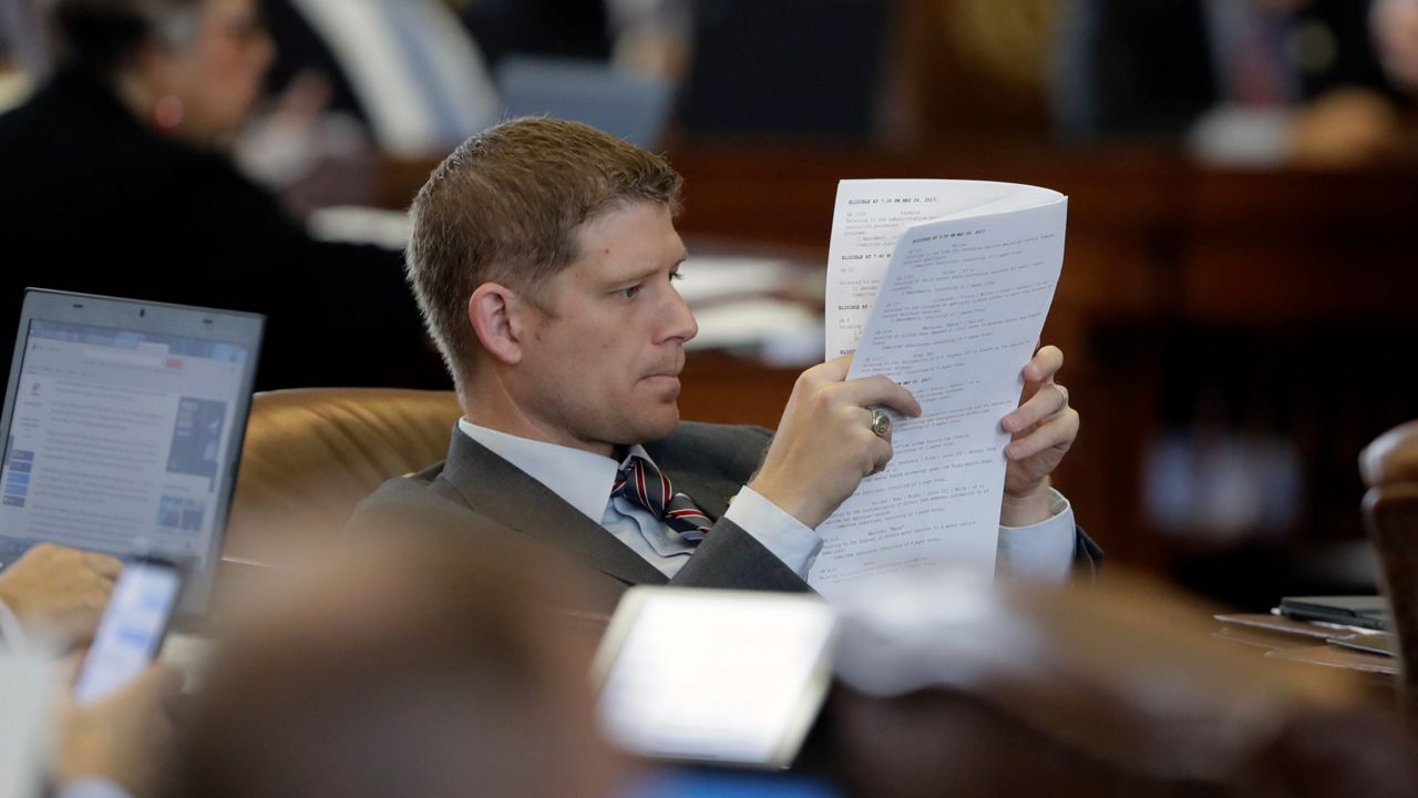 Texas Rep. Matt Krause, R-Fort Worth, looks over the calendar as lawmakers rush to finish business, Friday, May 26, 2017, in Austin, Texas. (AP Photo/Eric Gay)