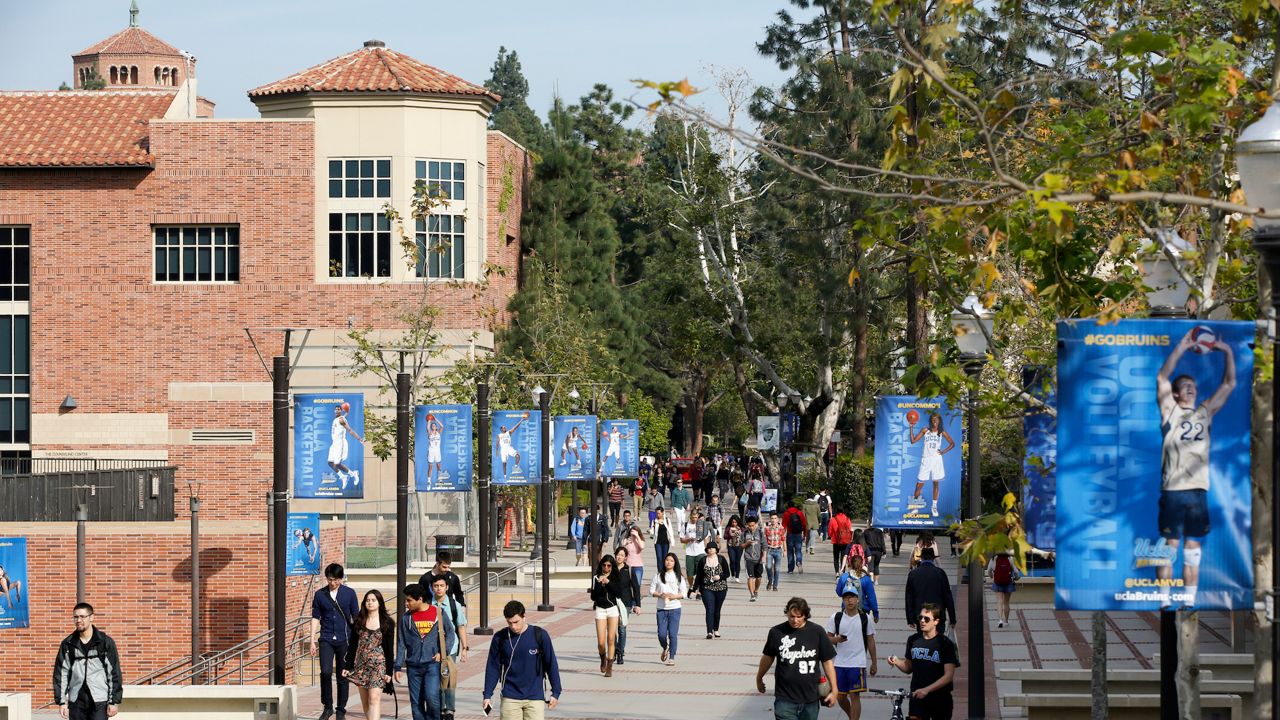 In this Feb. 26, 2015, file photo, students walk on the UCLA campus in Los Angeles. (AP Photo/Damian Dovarganes)