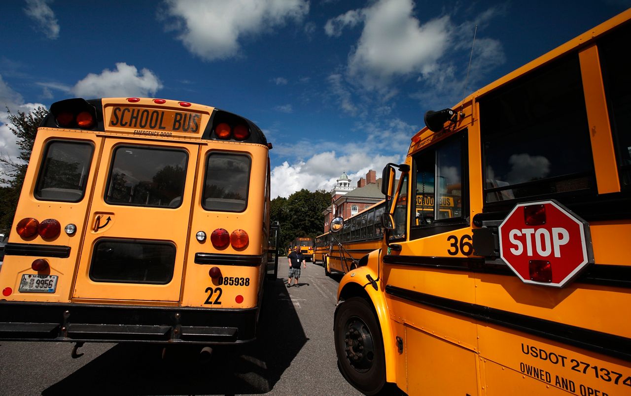 In this 2017 photo buses await students at York Middle School in York. A shortage of school bus drivers in some communities is causing headaches for school districts this fall. (AP Photo/Robert F. Bukaty)
