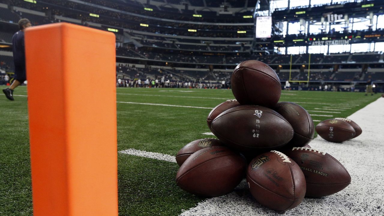 Footballs are stacked on each other by an end zone pylon before an NFL football game between the Los Angeles Rams and Dallas Cowboys on Sunday, Oct. 1, 2017, in Arlington, Texas. (AP Photo/Michael Ainsworth)