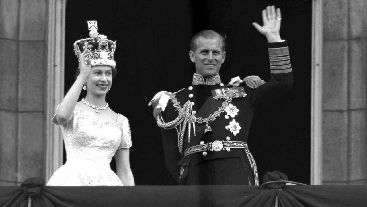 Britain's Queen Elizabeth II and Prince Philip, Duke of Edinburgh, as they wave to supporters from the balcony at Buckingham Palace, following her coronation at Westminster Abbey. London, June. 2, 1953. (AP Photo/Leslie Priest, File)