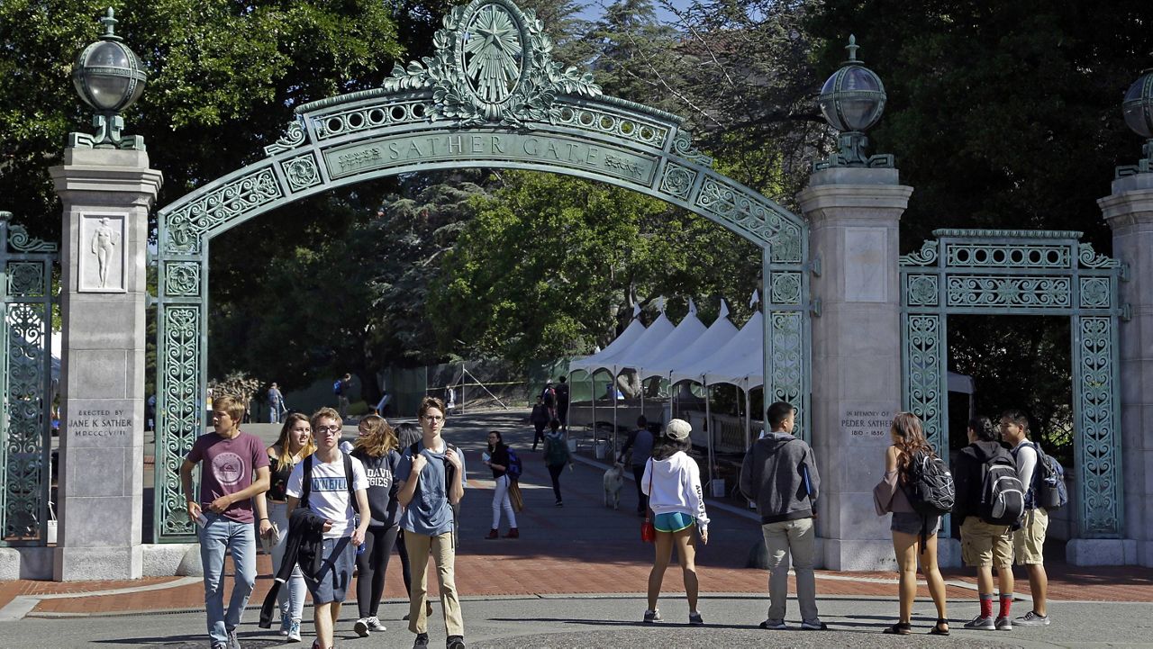 In this April 21, 2017, file photo, students walk past Sather Gate on the University of California, Berkeley campus in Berkeley, Calif. (AP Photo/Ben Margot, File)