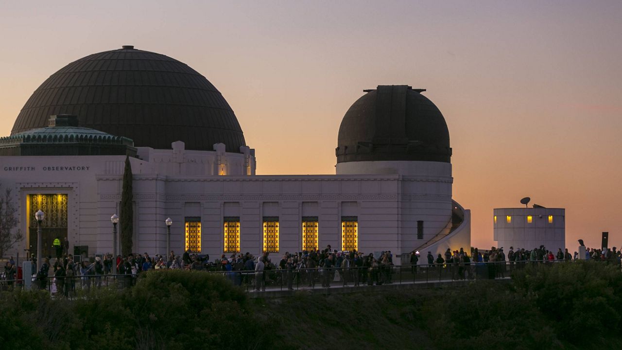 People gather at the Griffith Observatory of Mount Hollywood in Los Angeles' Griffith Park to watch the super blue blood moon on Jan. 31, 2018 (AP Photo/Damian Dovarganes)
