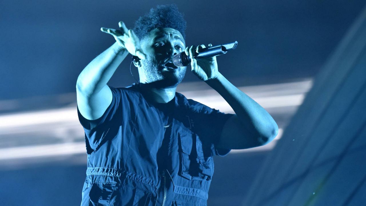 The Weeknd performs on day three at Lollapalooza in Grant Park on August 4, 2018 in Chicago. (Rob Grabowski/Invision/AP)