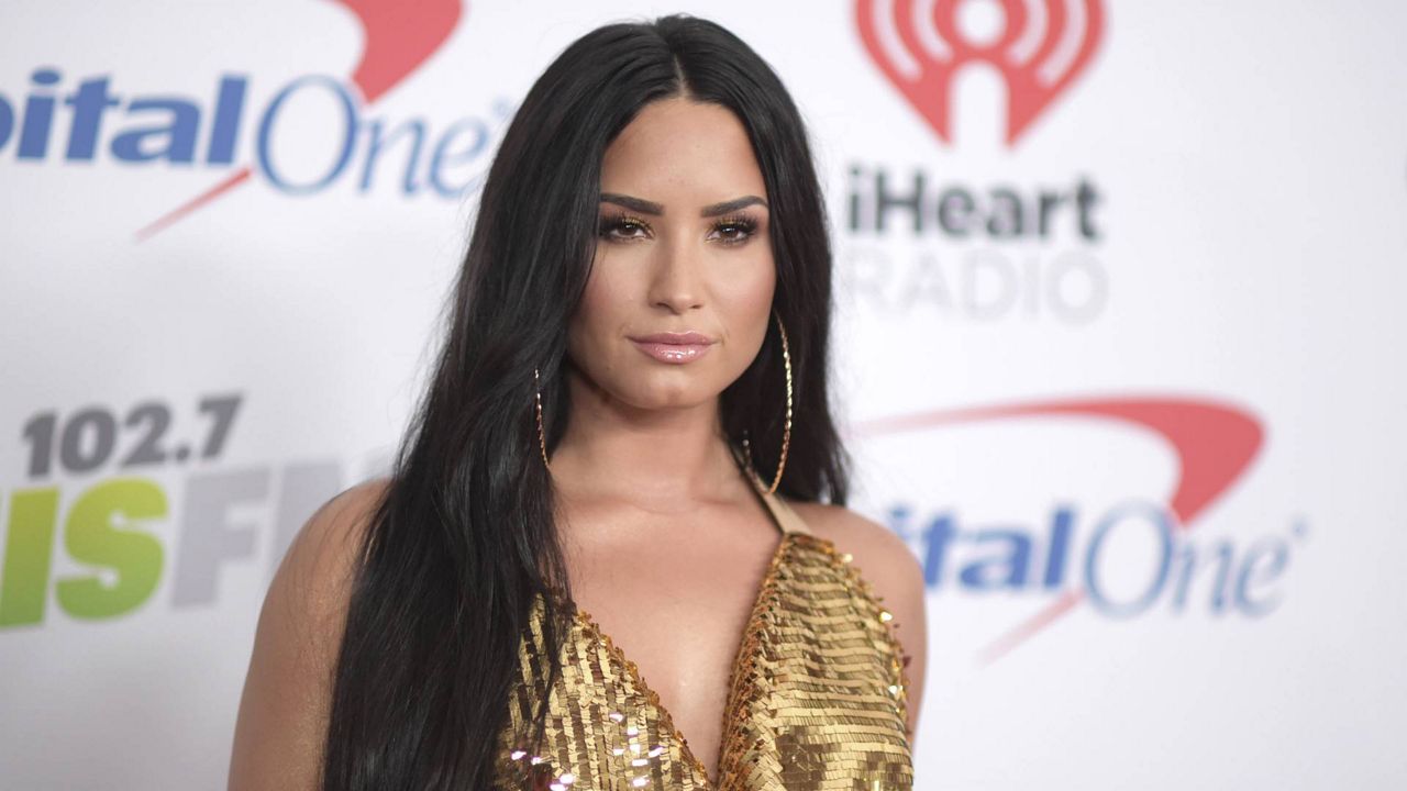 FILE - In this Dec. 1, 2017 photo, Demi Lovato arrives at Jingle Ball at The Forum in Inglewood, Calif. (Richard Shotwell/Invision/AP)