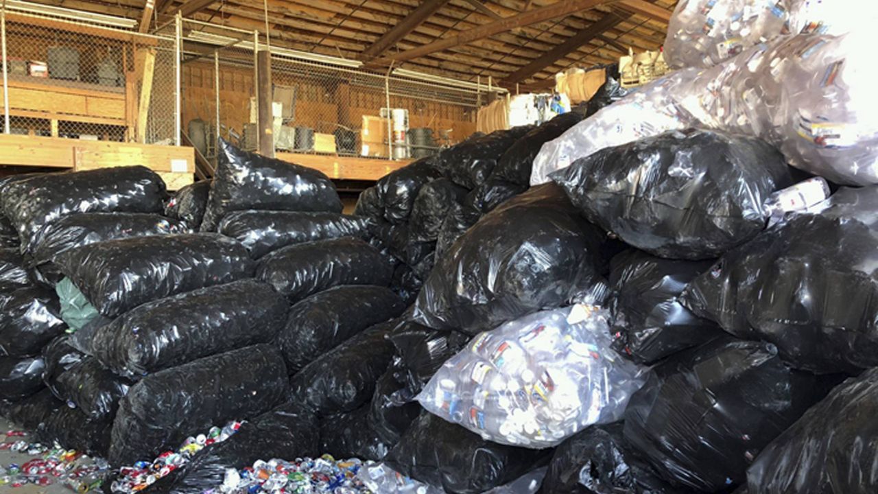 This June 6, 2018, photo provided by the California Department of Resources Recycling and Recovery (CalRecycle) and the California Department of Justice shows hundreds of pounds of revenue recyclables seized at a checkpoint in Barstow, Calif. (California Department of Justice/CalRecycle via AP)