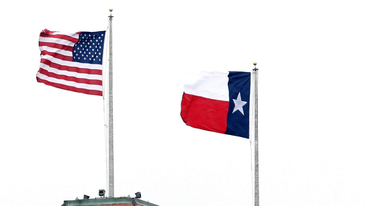 The Texas flag is flown near the American flag in this file image. (Associated Press)