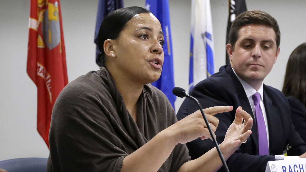 FILE - In this June 26, 2018 file photo, Suffolk County District Attorney Democratic candidate Rachael Rollins, left, takes questions directly from inmates during a forum at the Suffolk County House of Correction at South Bay, in Boston. (AP Photo/Steven Senne, File)