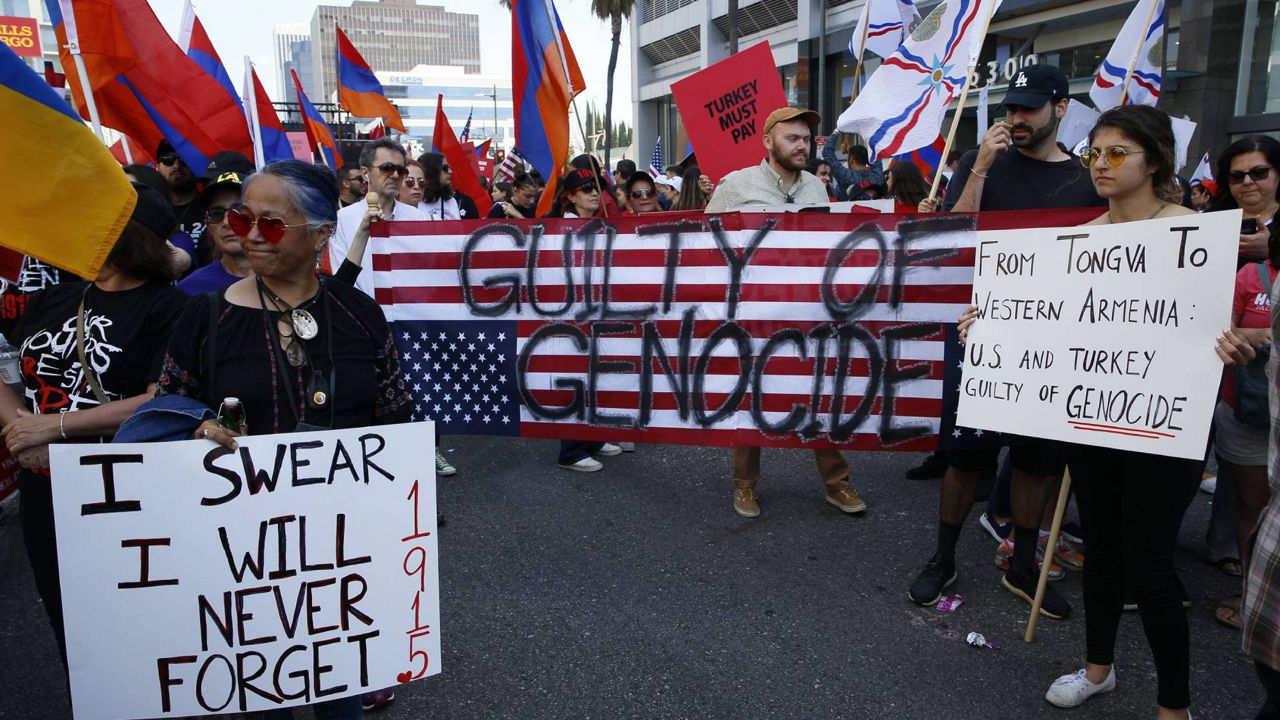 Huge crowds of Armenian Americans marched in Los Angeles in an annual commemoration of the deaths of 1.5 million Armenians under the Ottoman Empire, April 24, 2019. (AP Photo/Damian Dovarganes)
