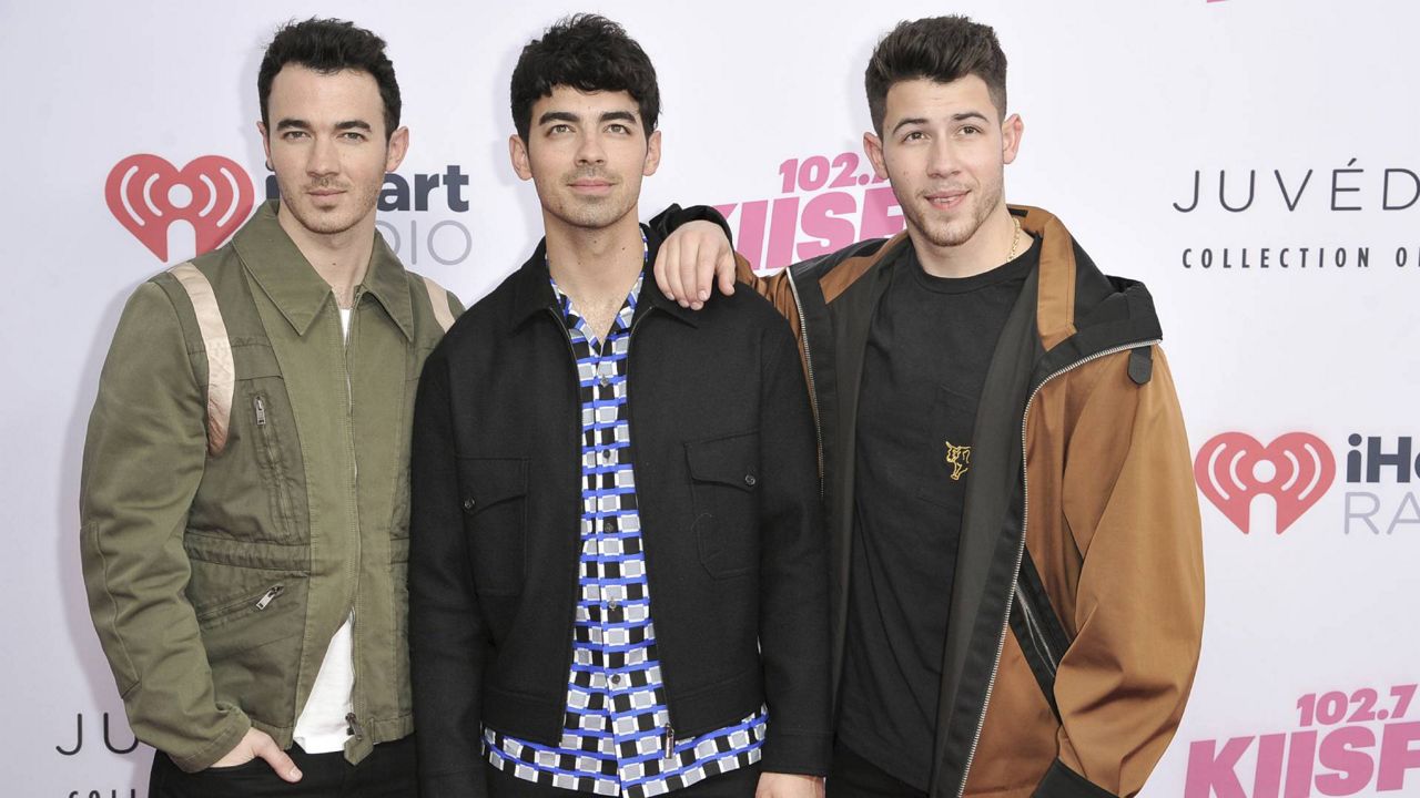 Kevin Jonas, from left, Joe Jonas and Nick Jonas attend 2019 Wango Tango at Dignity Health Sports Park on June 1, 2019, in Carson, Calif. (Photo by Richard Shotwell/Invision/AP)