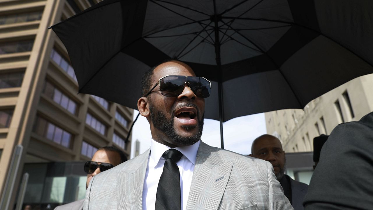 FILE PHOTO: Musician R. Kelly departs the Leighton Criminal Court building after pleading not guilty to 11 additional sex-related charges, Thursday, June 6, 2019, in Chicago. (AP Photo/Amr Alfiky)