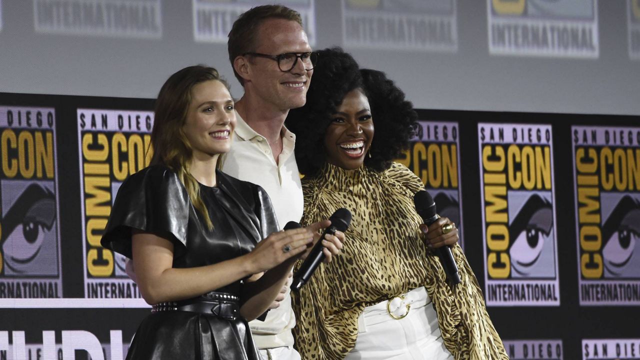 Elizabeth Olsen, Paul Bettany and Teyonah Parris participate in the "WandaVision" portion of the Marvel Studios panel on day three of Comic-Con International on July 20, 2019, in San Diego. (Photo by Chris Pizzello/Invision/AP)