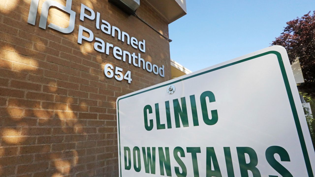 A sign is displayed at Planned Parenthood of Utah Wednesday, Aug. 21, 2019, in Salt Lake City. (AP Photo/Rick Bowmer)