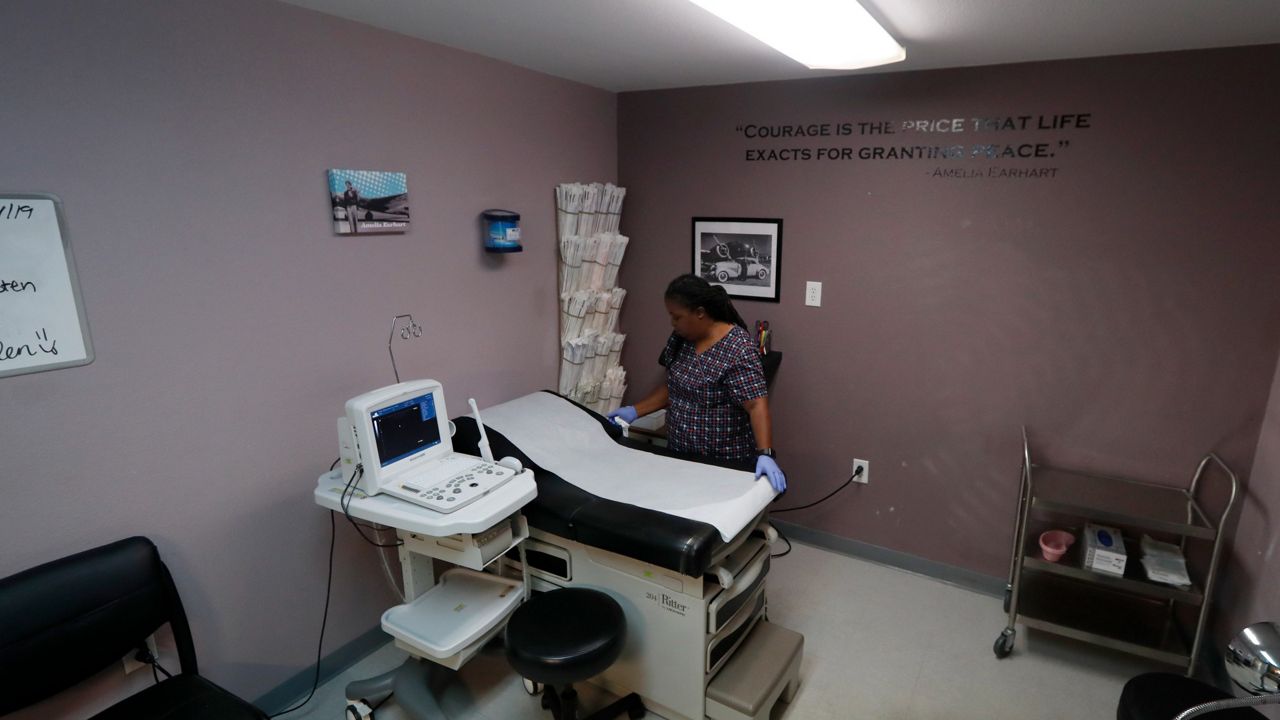 Director of Clinical Services, Marva Sadler, prepares the operating room at the Whole Woman's Health clinic in Fort Worth, Texas, Wednesday, Sept. 4, 2019. (AP Photo/Tony Gutierrez)