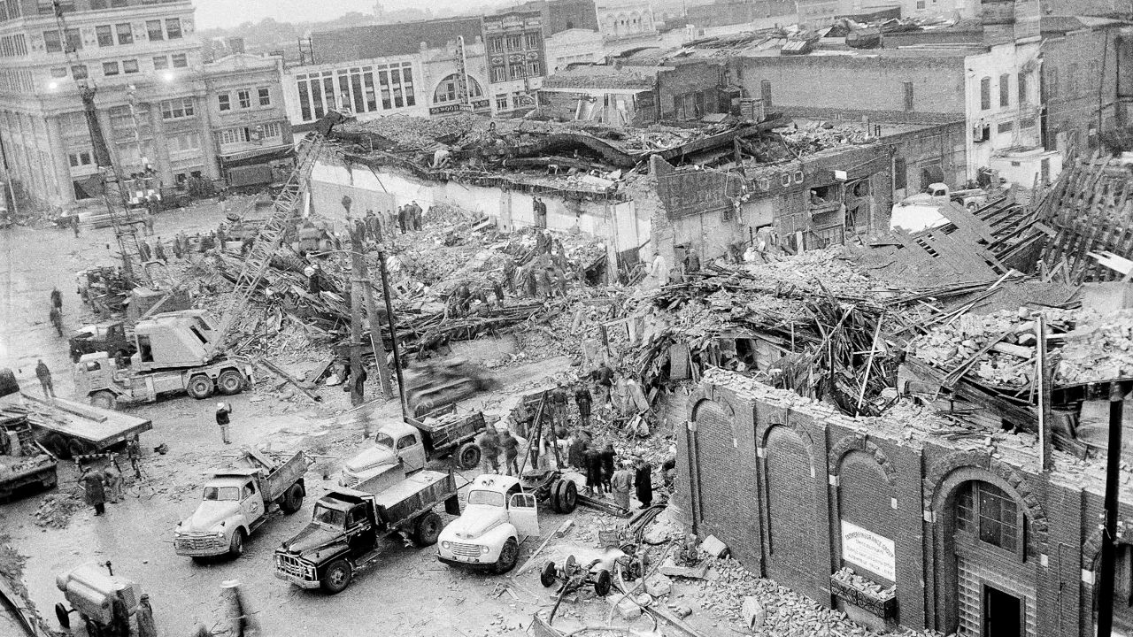 Civilian, Army and Air Force workers, bolstered by heavy equipment, start the gigantic task of cleaning up wreckage remaining in the downtown area of Waco, Texas, May 14, 1953, in the aftermath of the May 11 tornado. (AP Photo)