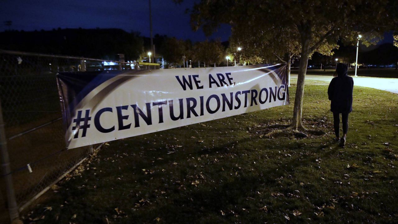 FILE - A sign reads #centurionstrong during a vigil at Central Park in the aftermath of a shooting at Saugus High School, Nov. 14, 2019, in Santa Clarita, Calif. (AP/Marcio Jose Sanchez)