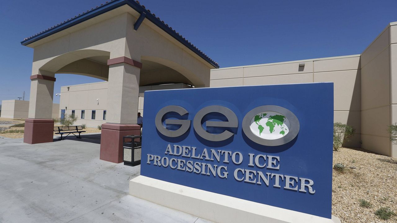 In this Aug. 28, 2019, file photo, the Adelanto U.S. Immigration and Enforcement Processing Center operated by GEO Group, Inc. (GEO), a Florida-based company specializing in privatized corrections, is viewed in Adelanto, Calif. (AP Photo/Chris Carlson, File)