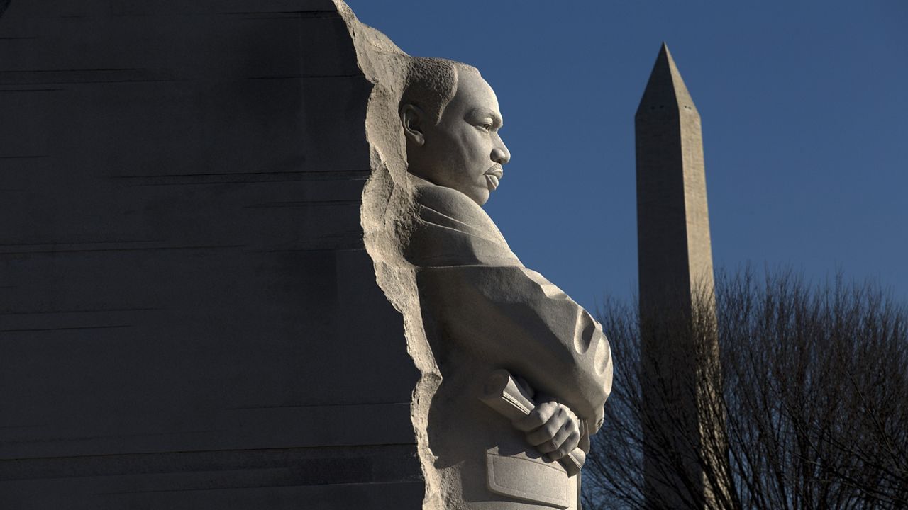 The Martin Luther King, Jr. Memorial is seen with the Washington Monument, during the 9th Annual Wreath Laying and Day of Reflection and Reconciliation, in Washington, Monday, Jan.20, 2020. (AP Photo/Jose Luis Magana)