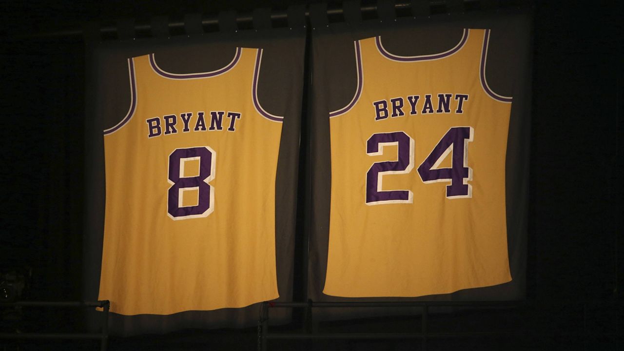 Los Angeles Lakers jersey numbers belonging to retired NBA player Kobe Bryant hang inside Staples Center prior to the start of the 62nd annual Grammy Awards on Sunday, Jan. 26, 2020, in Los Angeles. Bryant, the 18-time NBA All-Star who won five championships during a 20-year career with the Los Angeles Lakers, died in a helicopter crash in January. He was 41. (Photo by Matt Sayles/Invision/AP)