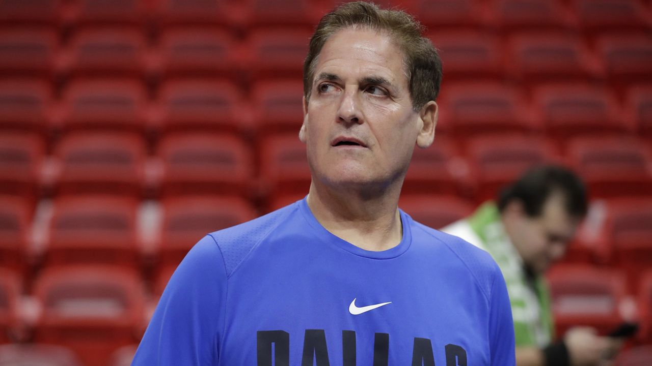 Dallas Mavericks owner Mark Cuban watches players warm up before the start of an NBA basketball game against the Miami Heat, Friday, Feb. 28, 2020, in Miami. (AP Photo/Wilfredo Lee)