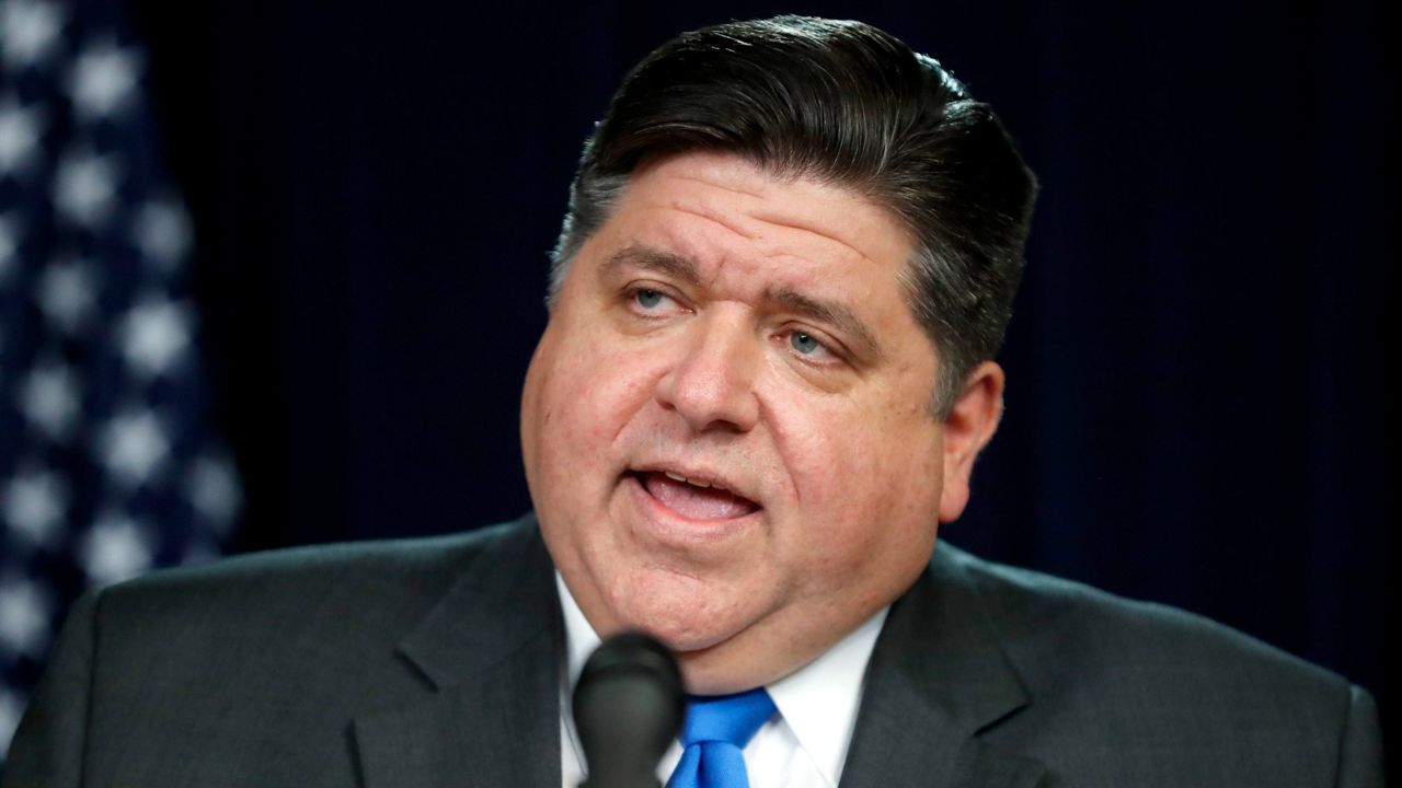 Illinois Gov. J.B. Pritzker announces a shelter-in-place rule to combat the spread of the COVID-19 virus during a news conference Friday, March 20, 2020. (AP Photo/Charles Rex Arbogast)
