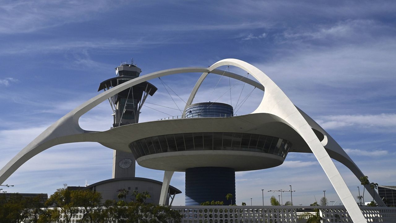 General overall view of the Theme Building and air traffic control tower at Los Angeles International Airport (LAX), Sunday, Jan. 5, 2020, in Los Angeles. (Kirby Lee via AP)