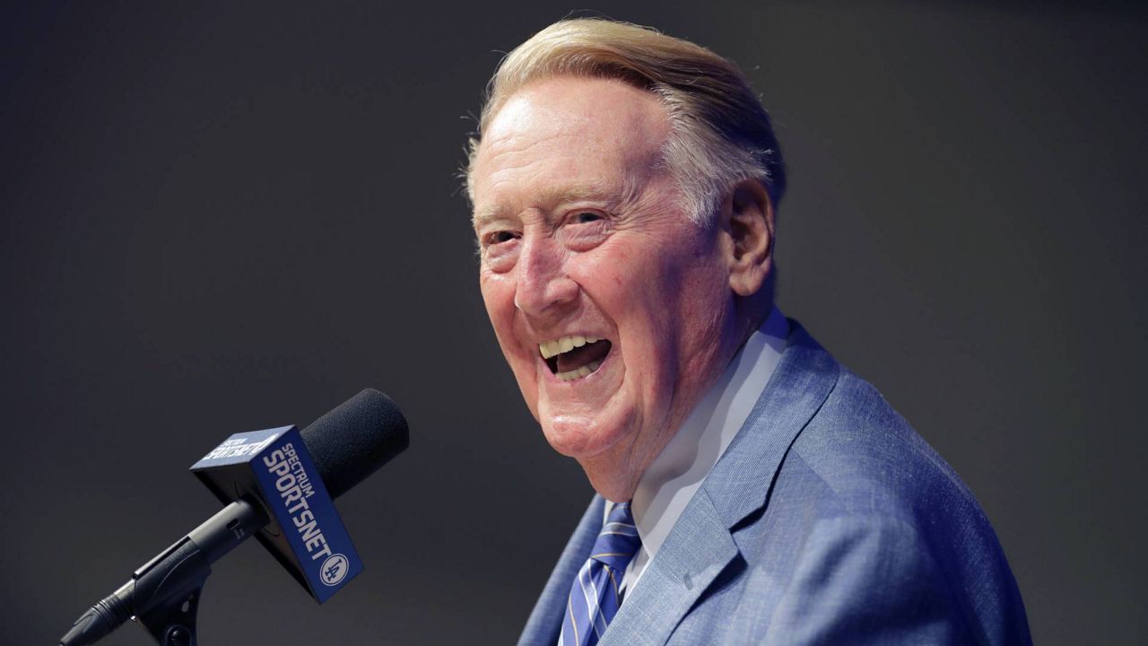 A baseball life: Scully auctions items from 67-year career