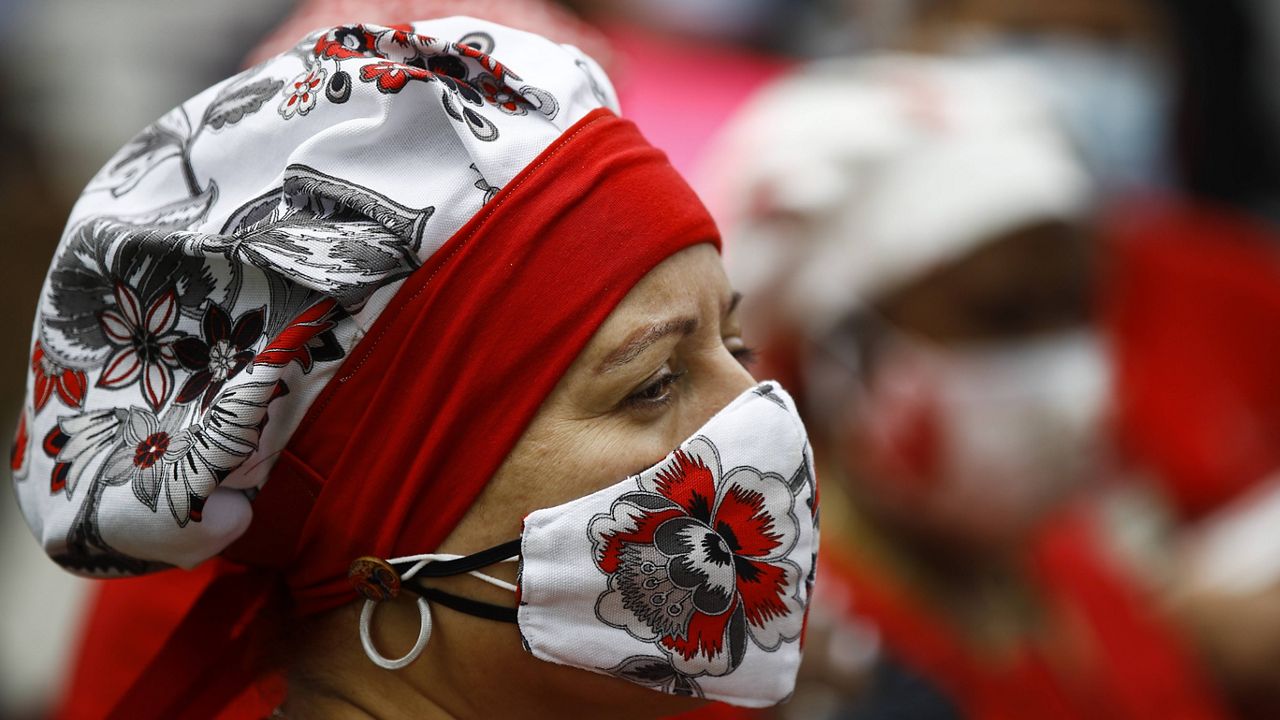 A woman wears a mask in Philadelphia in May. (AP Photo/Matt Rourke/File)
