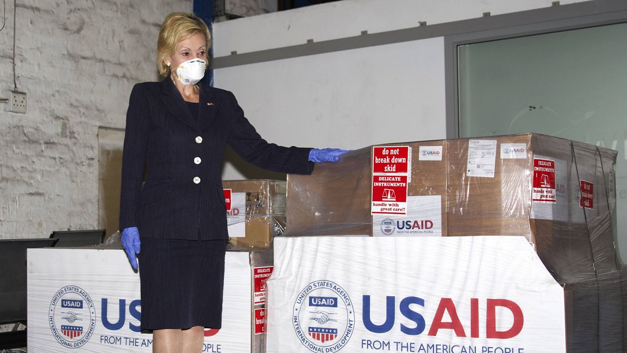 U.S. Ambassador to South Africa Lana Marks posing with ventilators donated by the U.S. government to South Africa. (Photo/Leon Kgoedi, United States Embassy South Africa via AP)