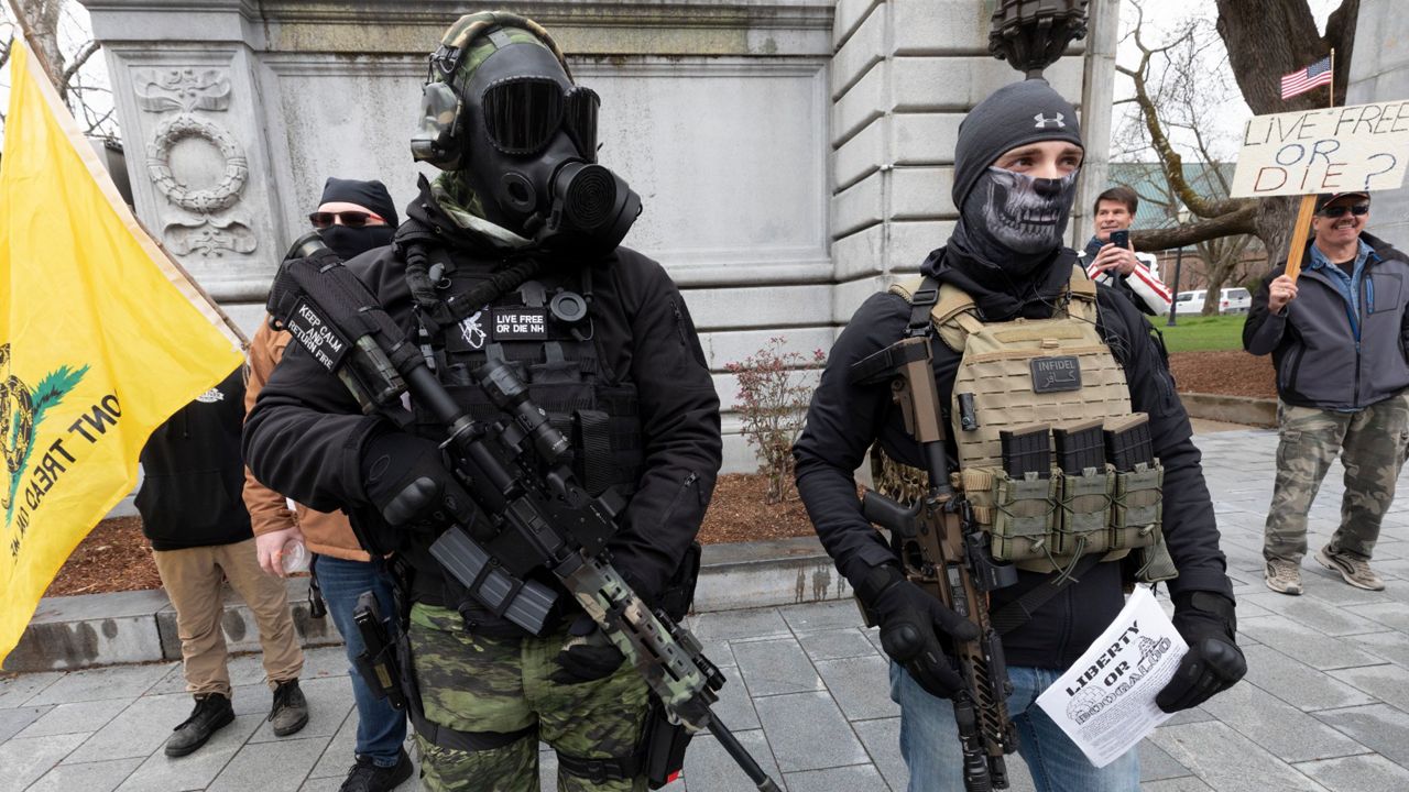 Members of the boogaloo movement attend a demonstration against the lockdown at the State House in Concord, N.H. (AP Photo/Michael Dwyer, File)