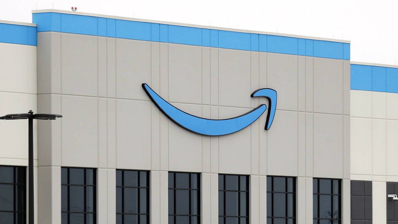 The Amazon logo sits at the top of the building by a main entrance into the newly constructed fulfillment facility, May 20, 2020. (AP/Tony Gutierrez)