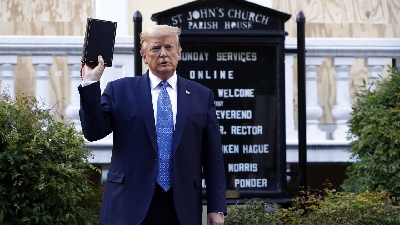 In this June 1, 2020, file photo, then-President Donald Trump holds a Bible as he visits outside St. John's Church across Lafayette Park from the White House amid racial justice protests in Washington. (AP Photo/Patrick Semansky, File)