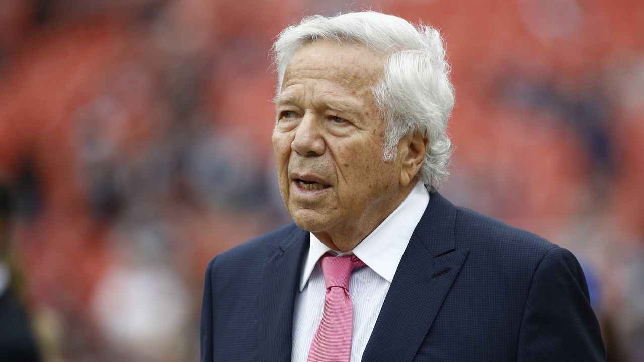 FILE - In this Oct. 6, 2019, file photo, New England Patriots owner Robert Kraft walks the turf ahead of an NFL football game between the Washington Redskins and the New England Patriots in Landover, Md. (AP Photo/Patrick Semansky, FIle)