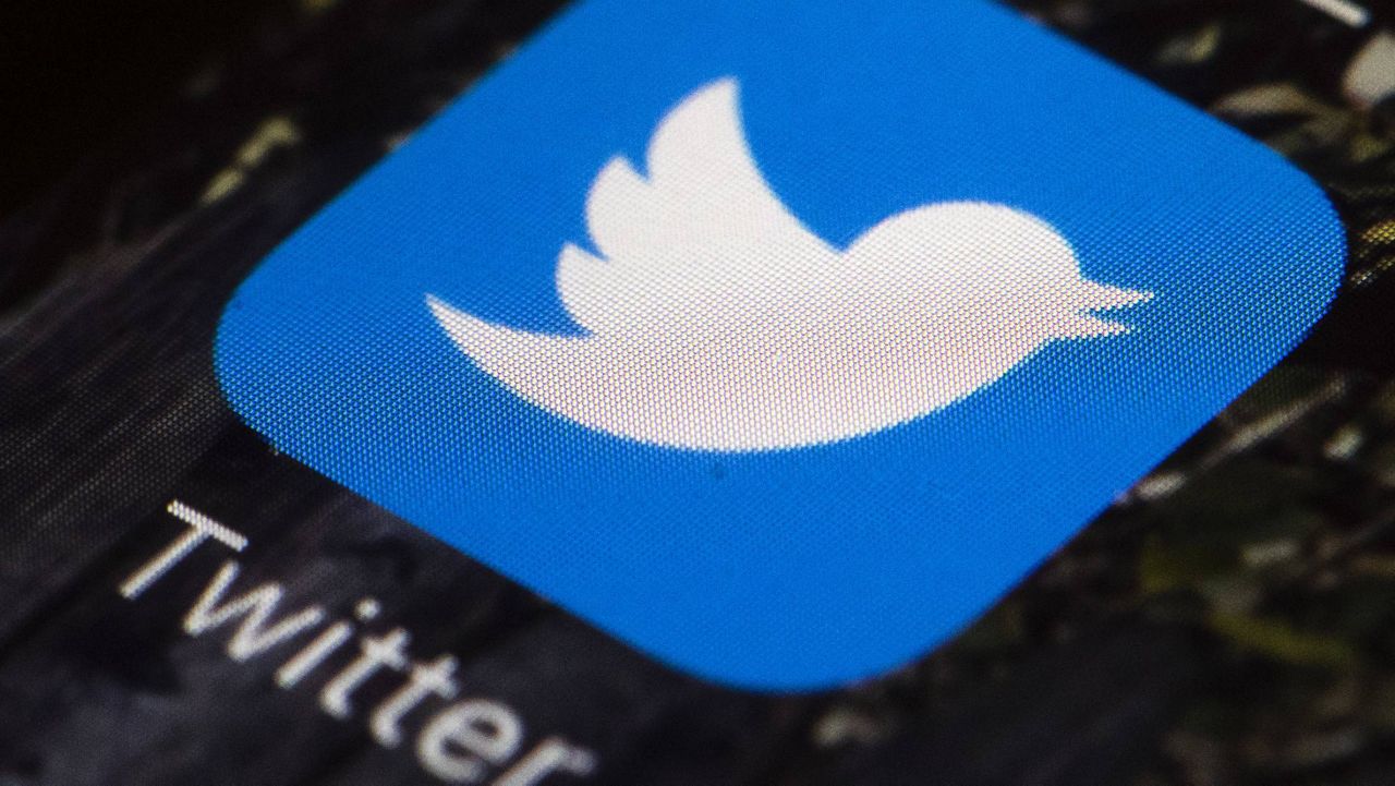 This April 26, 2017, file photo shows the Twitter app icon on a mobile phone. (AP Photo/Matt Rourke, File)