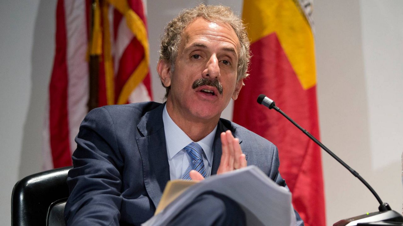 In this May 30, 2019, file photo, Los Angeles City Attorney Mike Feuer speaks at LA Police Headquarters. (AP Photo/Damian Dovarganes)