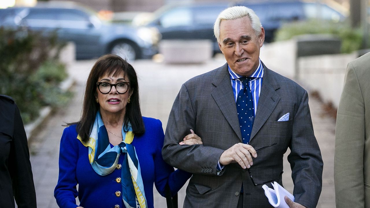 FILE - In this Nov. 8, 2019, file photo, Roger Stone, and his wife Nydia, arrive at federal court in Washington. (AP Photo/Al Drago, File)