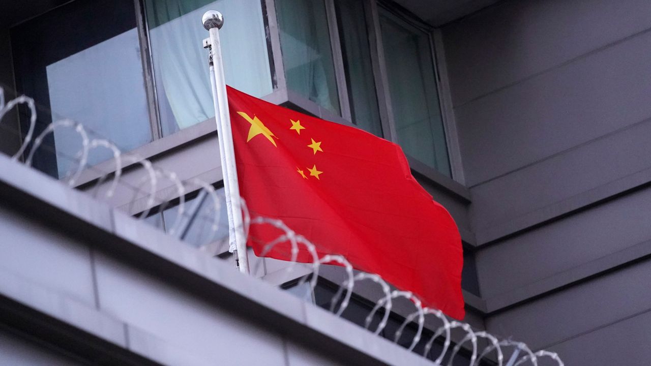 The flag of China flies outside the Chinese Consulate Wednesday, July 22, 2020, in Houston. (AP Photo/David J. Phillip)