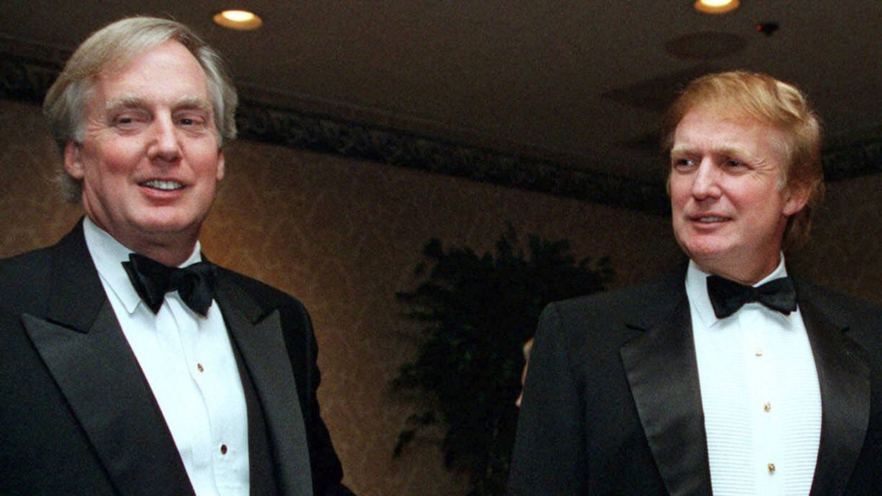 In this Nov. 3, 1999, file photo, Robert Trump, left, joins then real estate developer and presidential hopeful Donald Trump at an event in New York. (AP Photo/Diane Bonadreff, File)