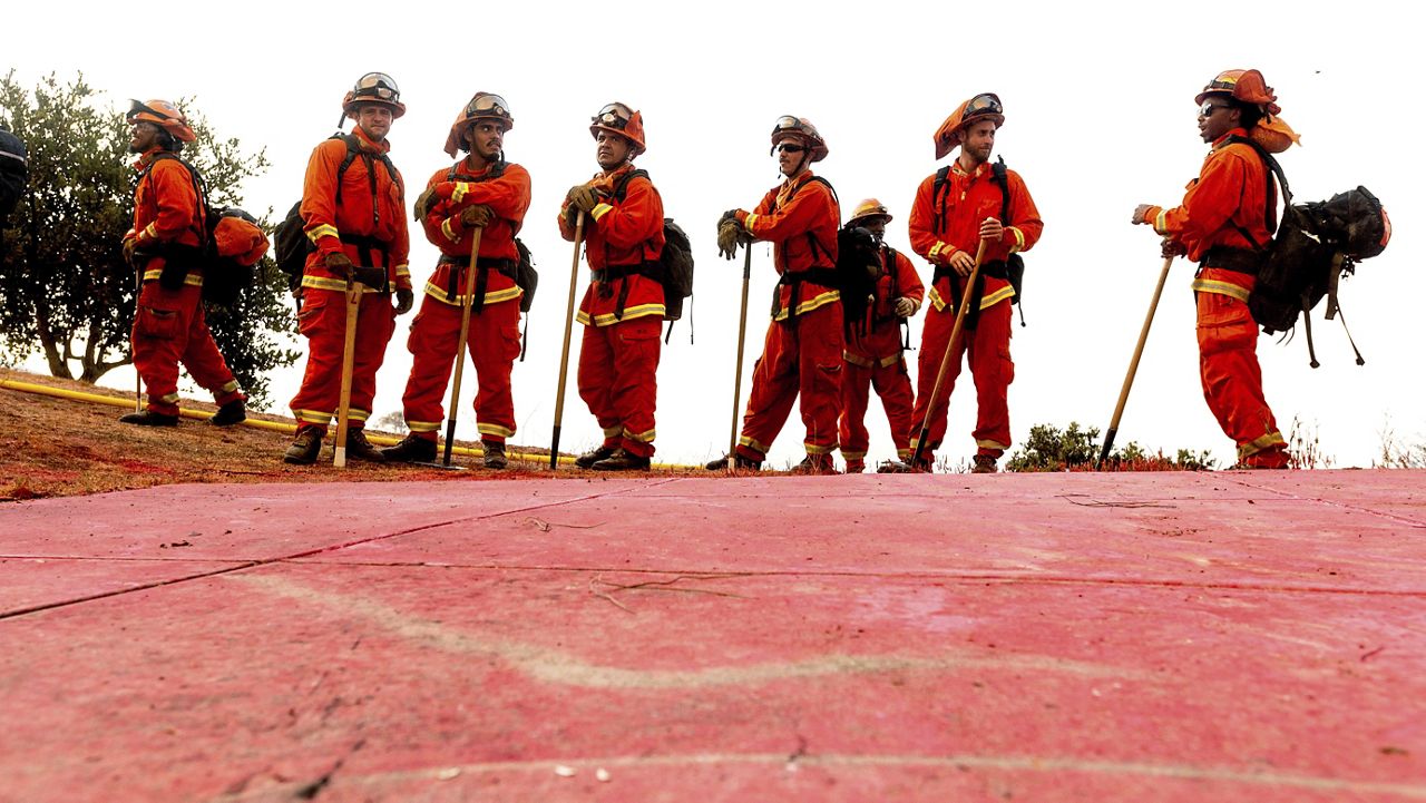 Inmate firefighters prepare to take on the River Fire in Salinas, Calif., Monday, Aug. 17, 2020. (AP Photo/Noah Berger)