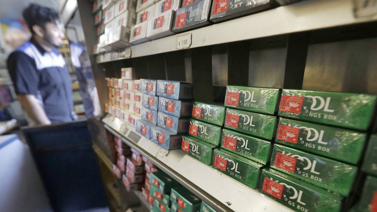 This May 17, 2018 photo shows packs of menthol cigarettes and other tobacco products at a store in San Francisco. (AP Photo/Jeff Chiu)