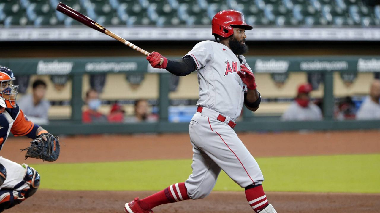 Angels right fielder Brian Goodwin watches his one-run double during the first game of a doubleheader Tuesday, August 25, 2020, in Houston. (AP Photo/Michael Wyke)