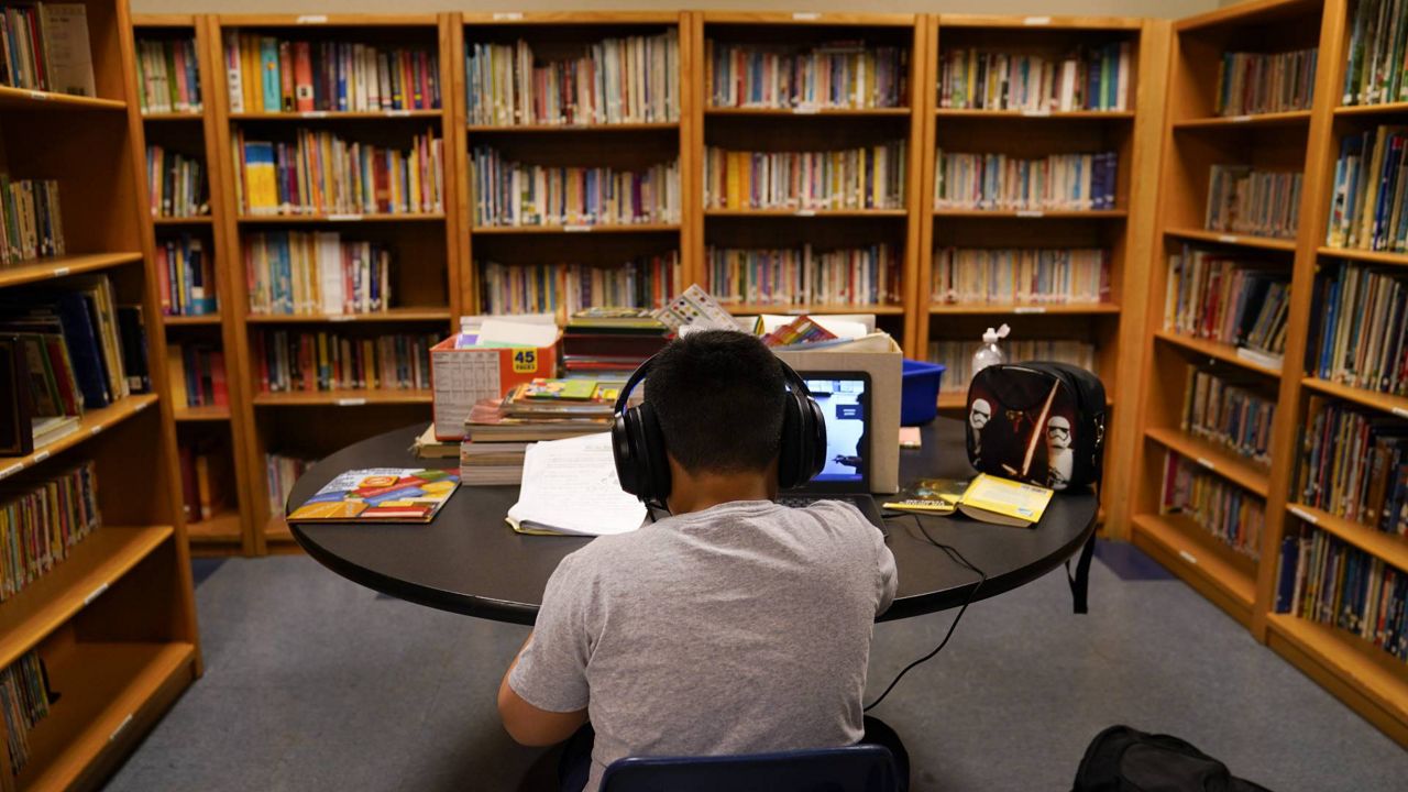 A Los Angeles Unified School District student attends an online class at Boys & Girls Club of Hollywood Wednesday, Aug. 26, 2020. (AP Photo/Jae C. Hong)