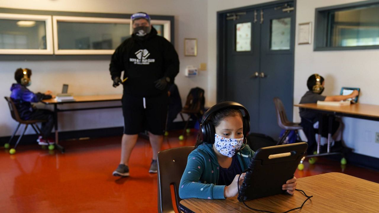 LAUSD students attend online classes at Boys & Girls Club of Hollywood in Los Angeles, Aug. 26, 2020. Cedars-Sinai is the latest organization to begin working with the district on their COVID-19 testing program. (AP Photo/Jae C. Hong)