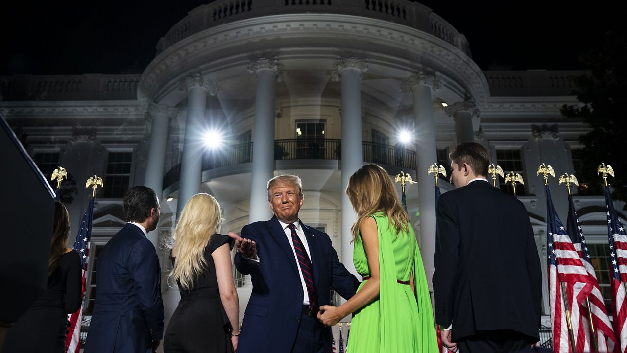 Donal Trump Jr., Tiffany Trump, President Donald Trump, first lady Melania Trump and Barron Trump stand on the South Lawn of the White House on the fourth day of the Republican National Convention, Thursday, Aug. 27, 2020, in Washington. (AP Photo/Evan Vucci)